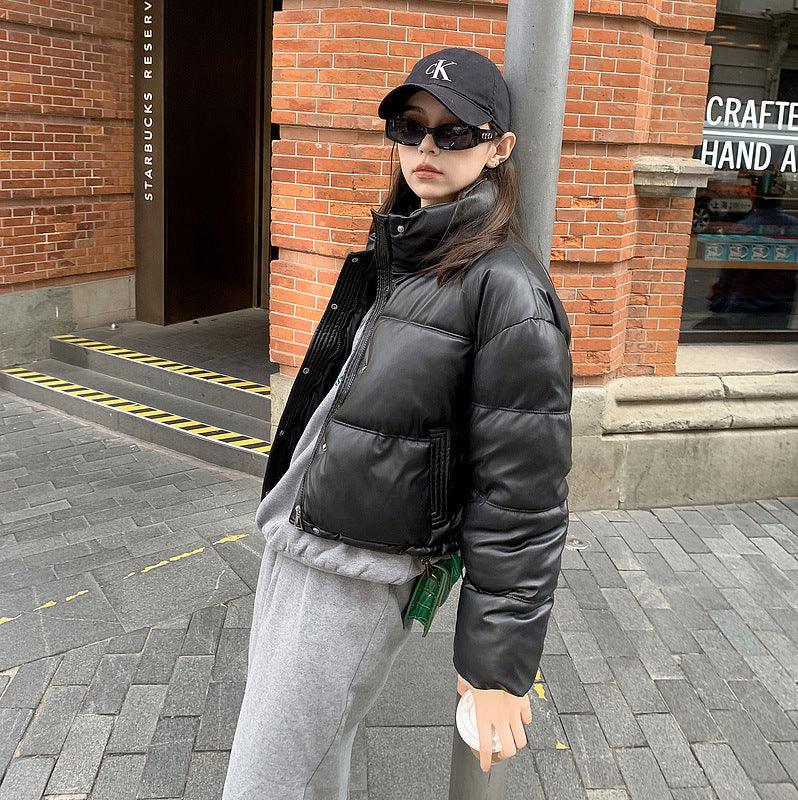 Black PU leather puffer winter coat with snap front, stand collar, and pockets