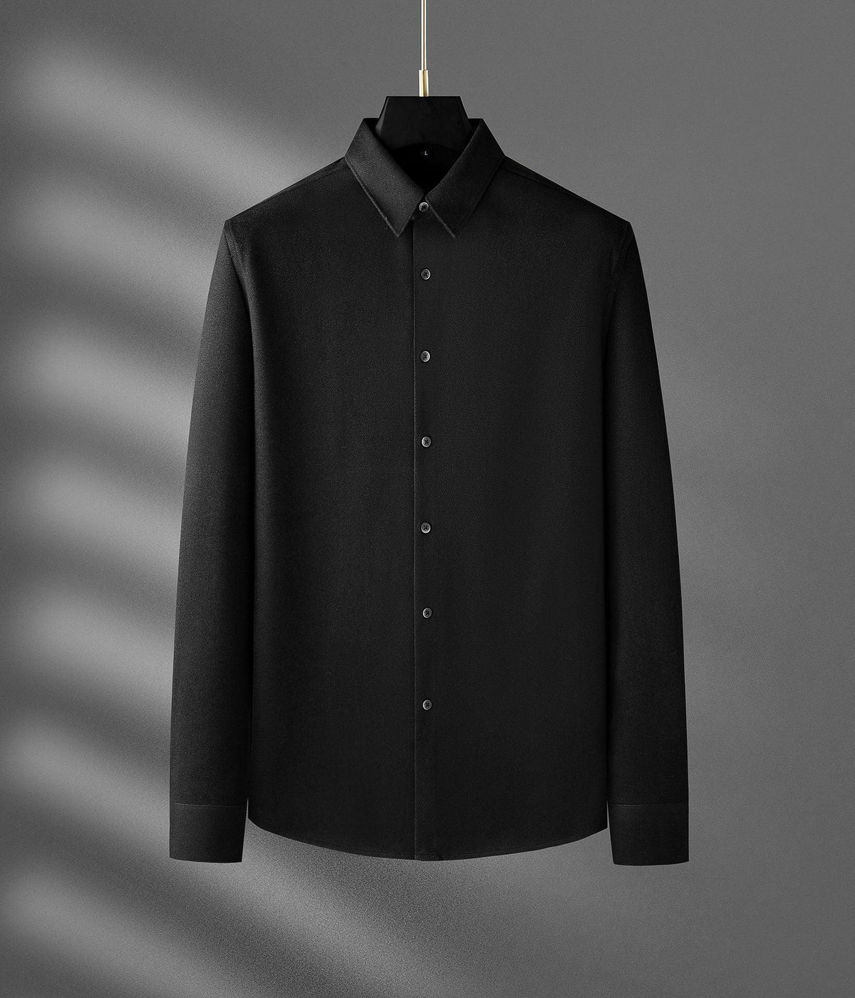 Men's long-sleeve button-up wool shirt, black, full front view on hanger