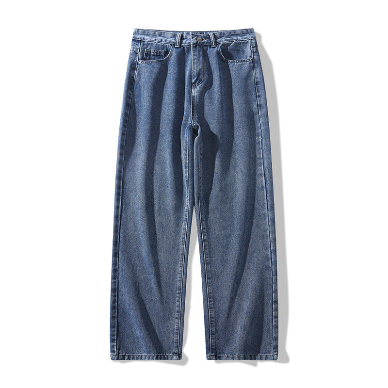 Medium blue washed wide-leg denim trousers with loose fit and button-front closure