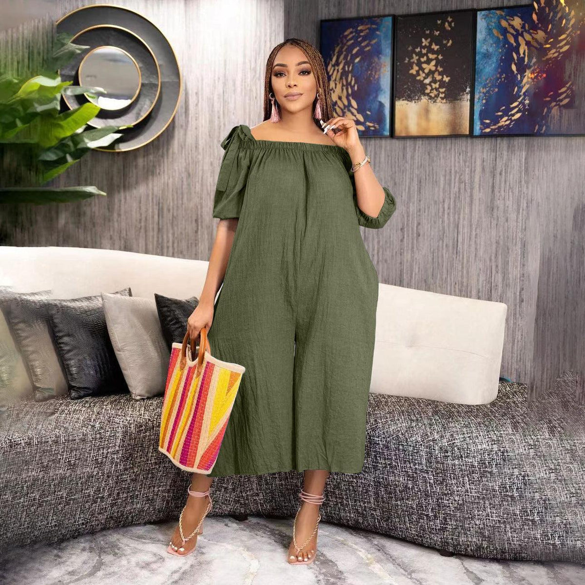 Green off-shoulder cropped jumpsuit with puff sleeves and loose wide-leg silhouette