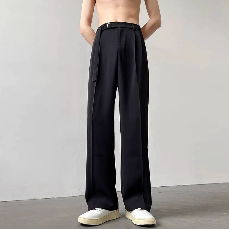 Black high-waist wide-leg pants with belt tie and relaxed drape