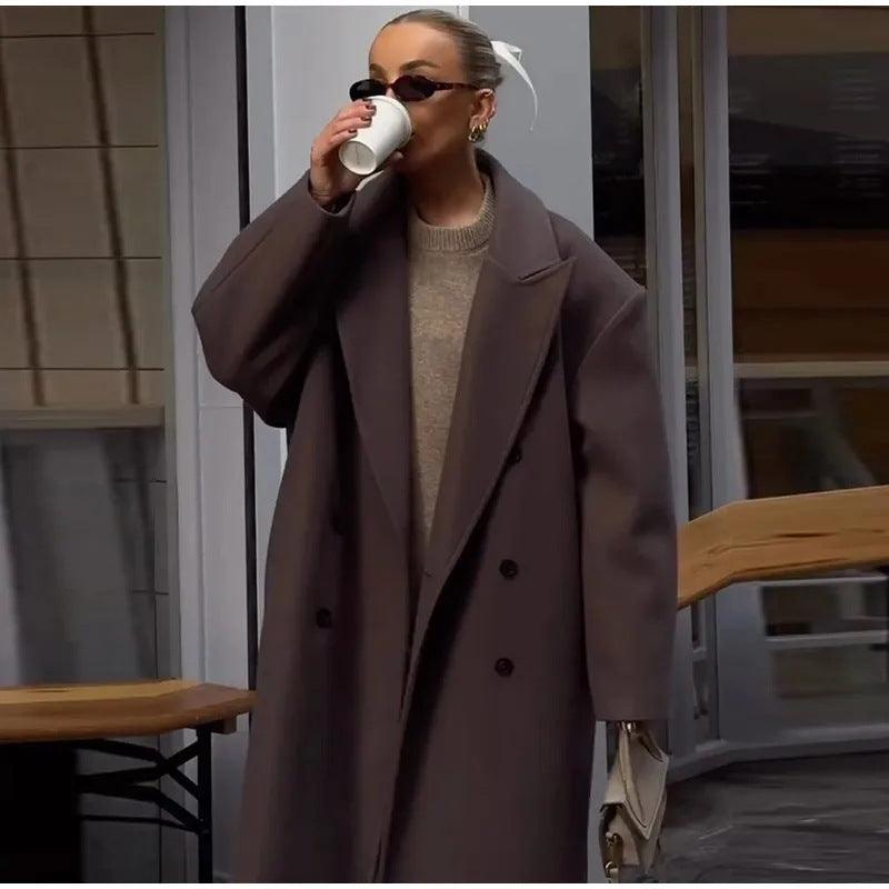 Women’s long dark brown double-breasted coat, notch lapels and visible front buttons
