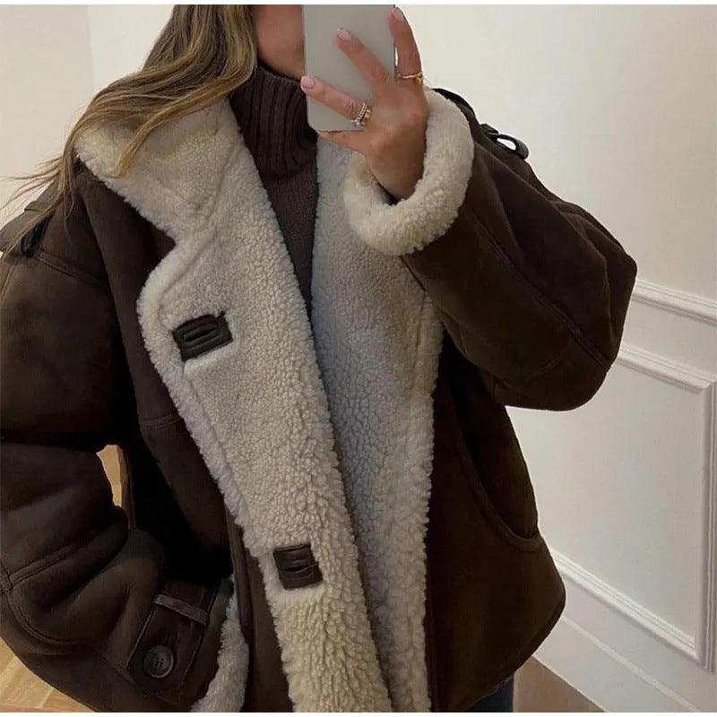 Dark brown suede-style shearling coat with teddy-fleece lining, button tabs, and side pockets