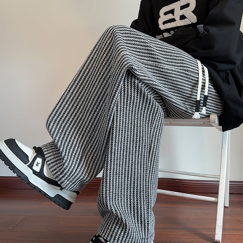 Wide-leg trousers with black-and-white check pattern and roomy drape