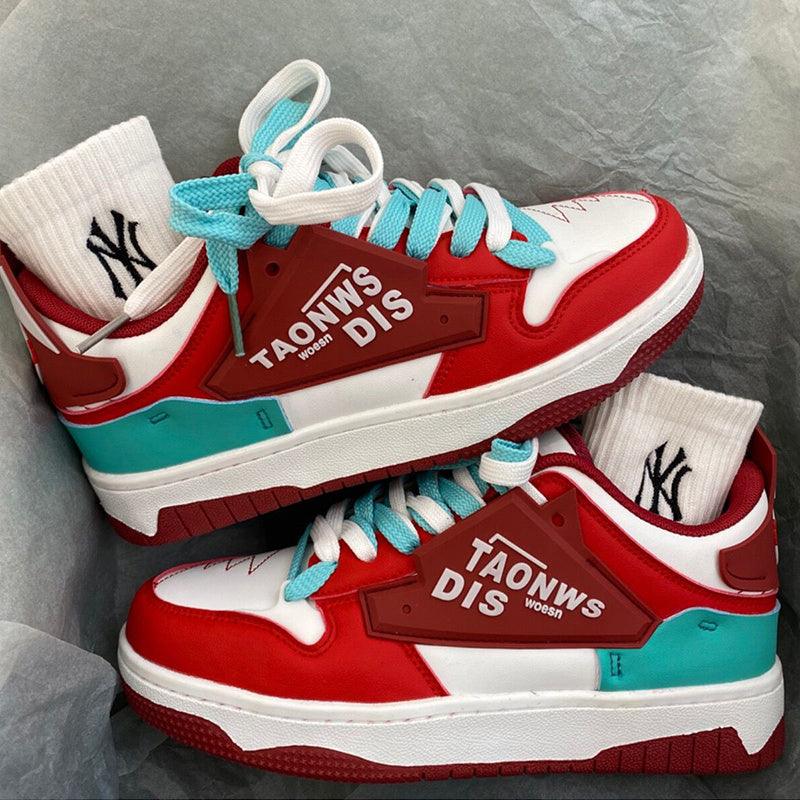 Low-cut anti-slip board shoes in red, white, and teal with light blue laces.