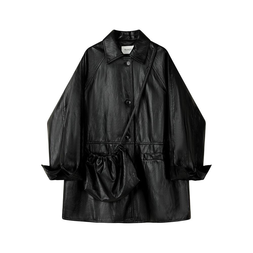 Black leather coat with stand collar, snap buttons, and front crossbody pocket