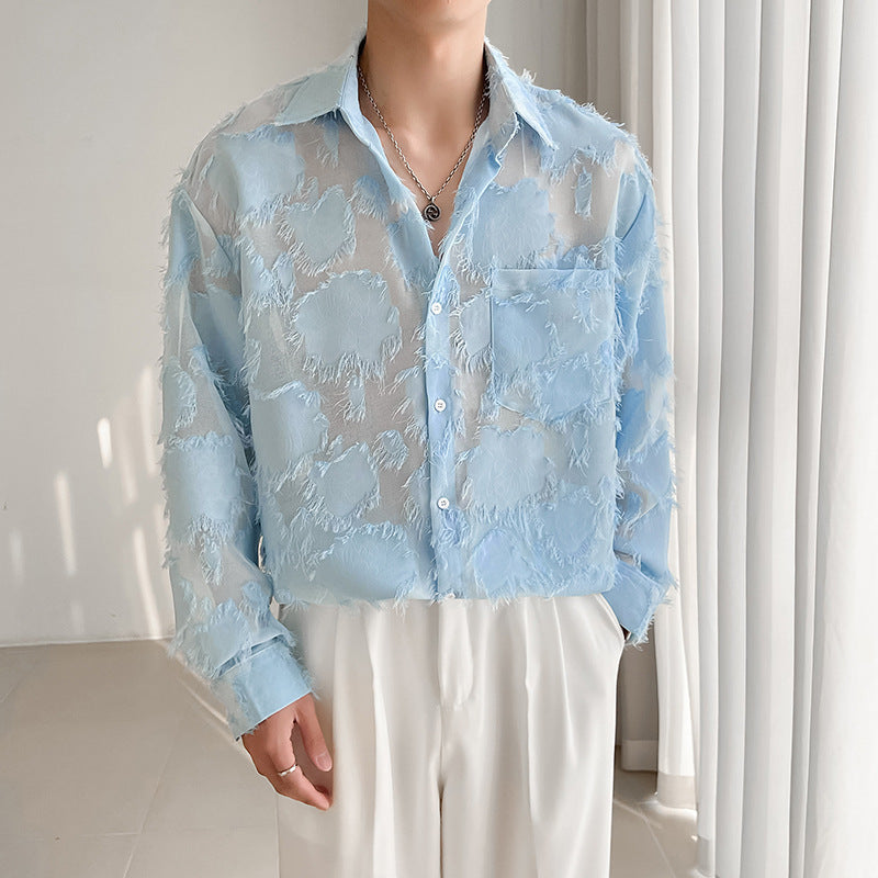 Sky blue long-sleeve button-up shirt with patchy textured pattern and frayed trim