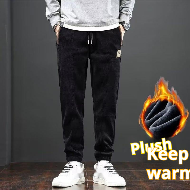 Black corduroy velvet loose trousers with drawstring, side pockets, cuffed hems