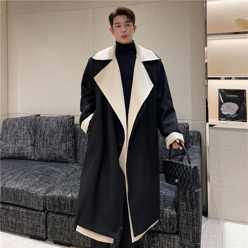 Black long coat with cream peak lapels and asymmetric panel trim, front button