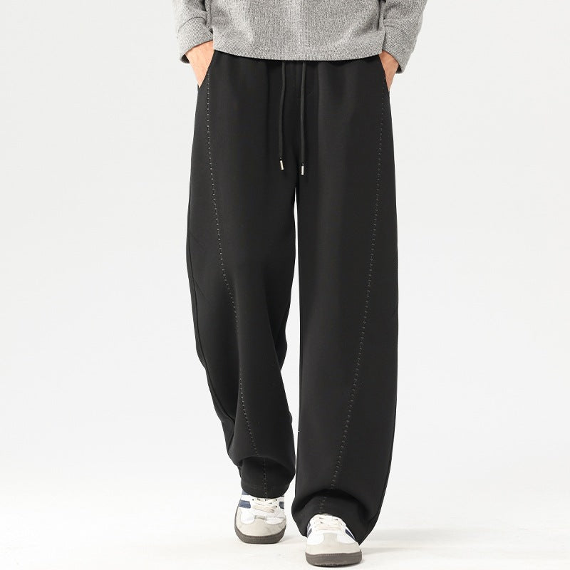 Men's loose drawstring pants, black wide-leg fit with side pockets and seam detail