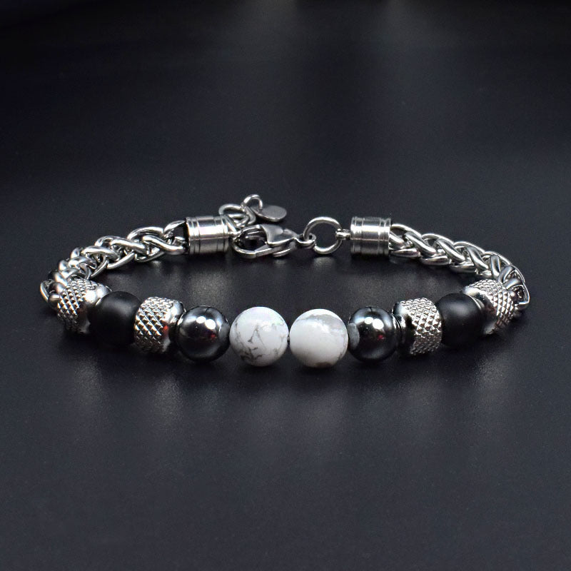 Men's stainless steel bracelet with dark beads, round white stone accents, and chain clasp.