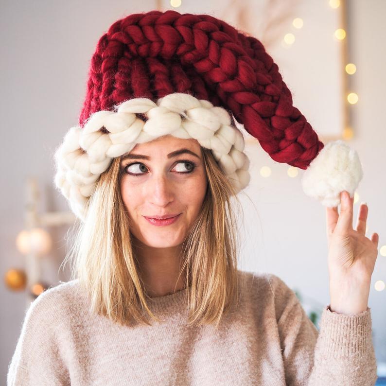 Christmas plush knit hat in claret red with chunky white trim and pom pom
