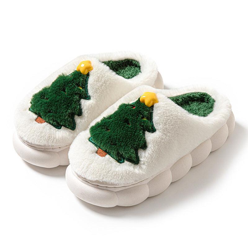 Beige women’s Christmas tree slippers with green tree applique, yellow star details, white soles
