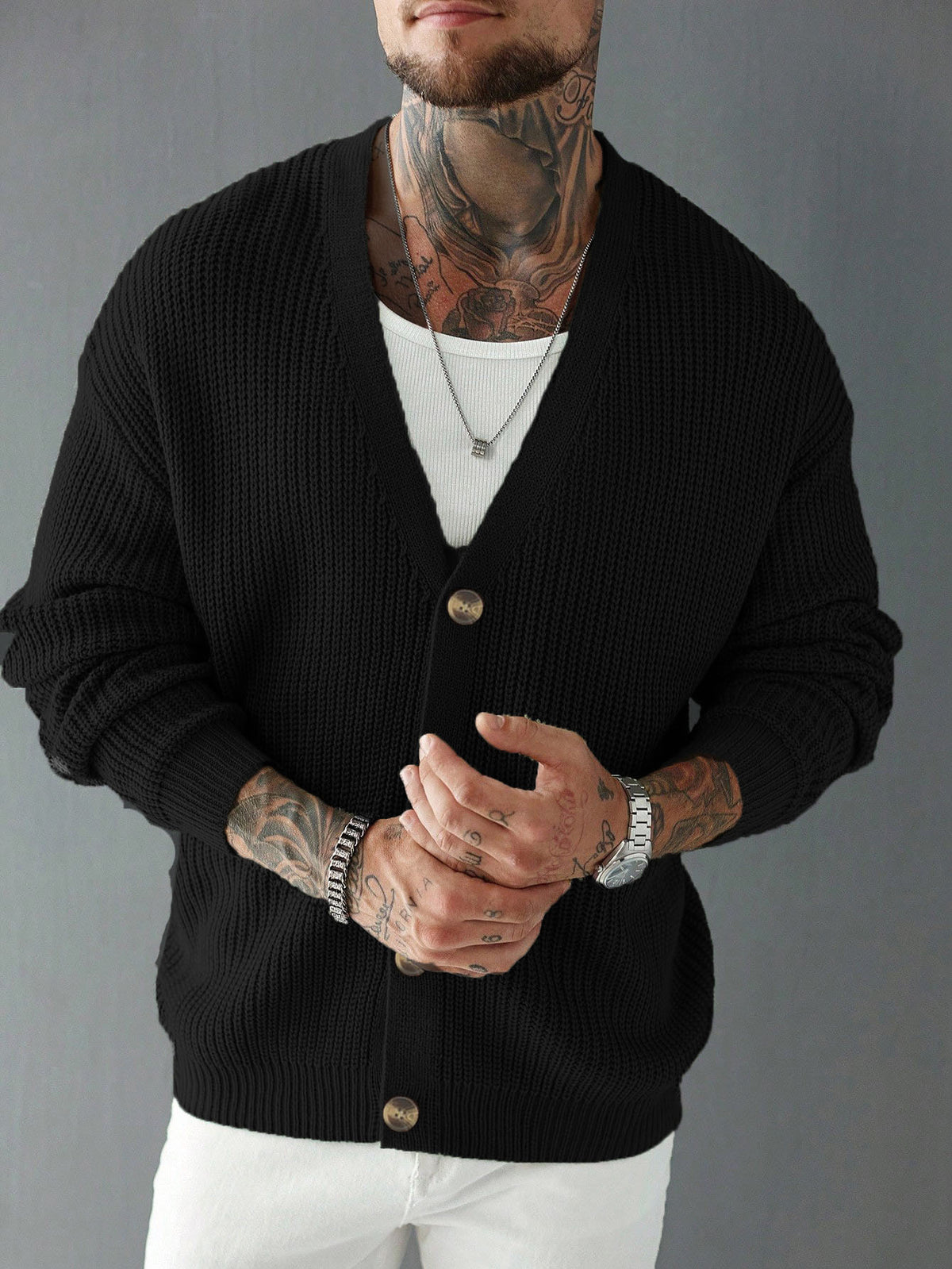 Black knit cardigan sweater, single-breasted V-neck with button front and long sleeves