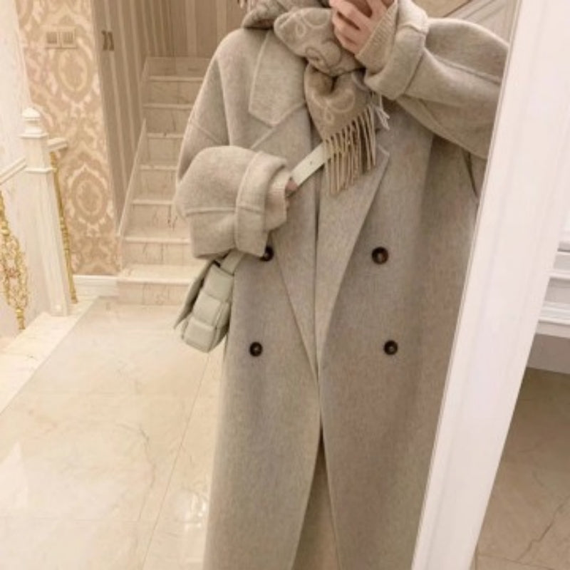 Beige apricot women's long overcoat with double-breasted dark buttons