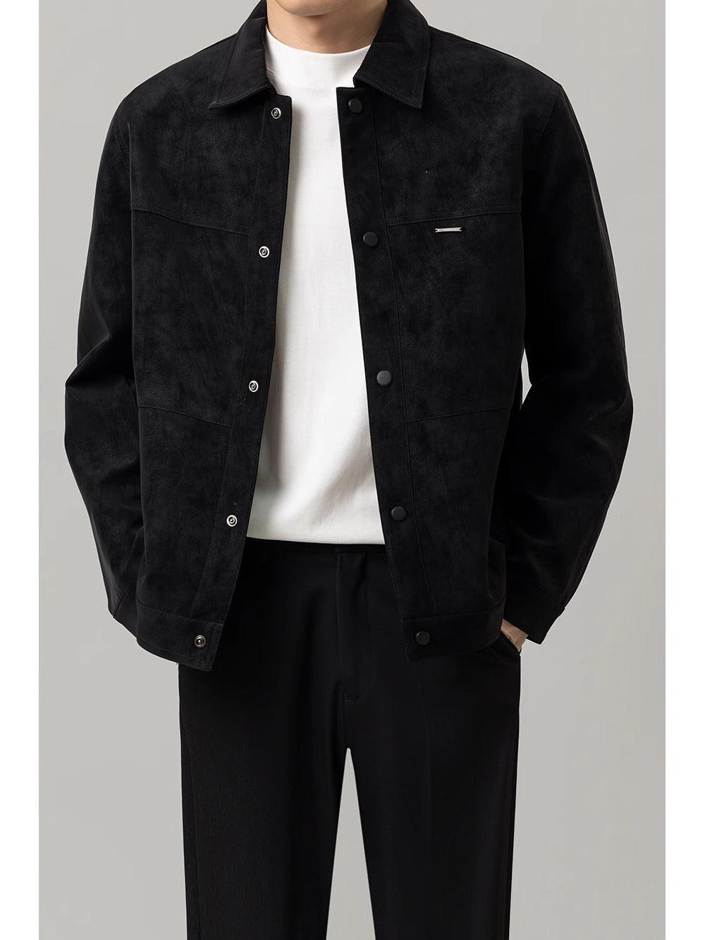 Men's short black jacket with button front and stand collar, featuring chest patch pockets