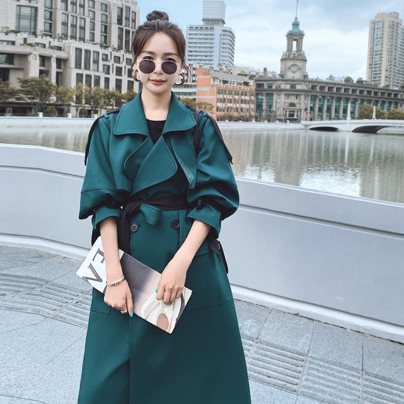 Women’s green windbreaker with oversized lapels and belted waist, front view