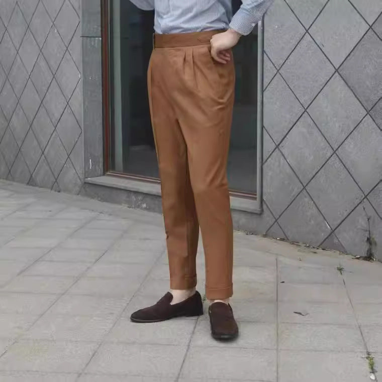 Caramel slim suit pants with pleated front, tapered legs, belt loop and buckle detail