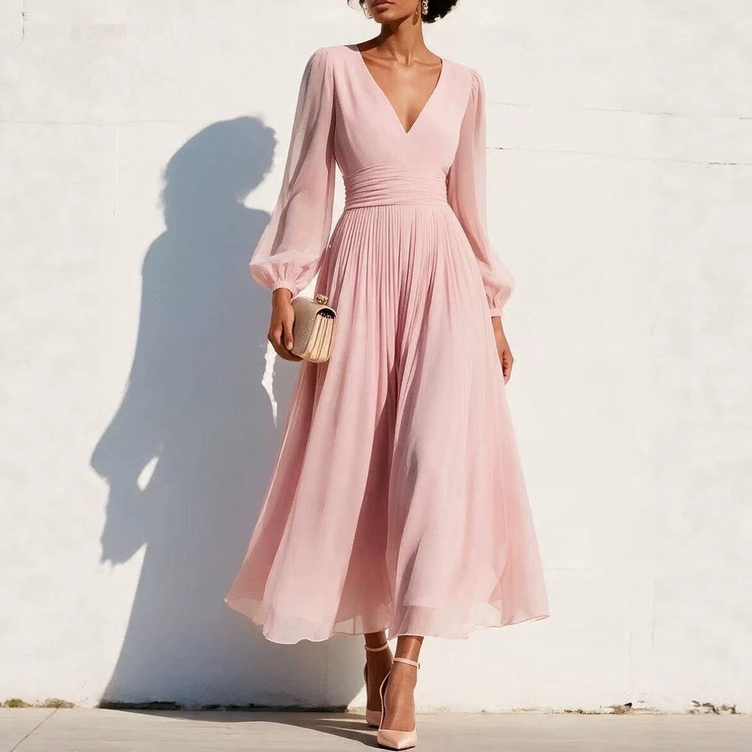 Fitted-waist pleated dress in light pink with V-neck and long sheer sleeves