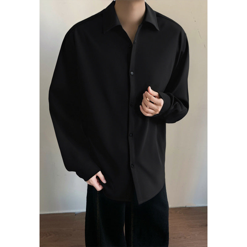 Black button-up casual shirt with pointed collar and long sleeves