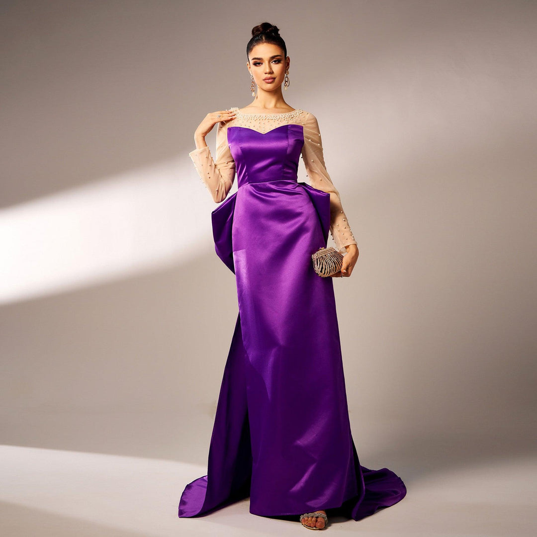 Purple satin evening dress with long sleeves, beaded lace bodice, and big waist bow