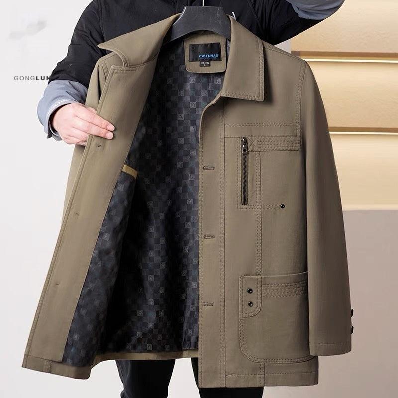 Men's olive coat open to show dark patterned lining, zip pocket on chest