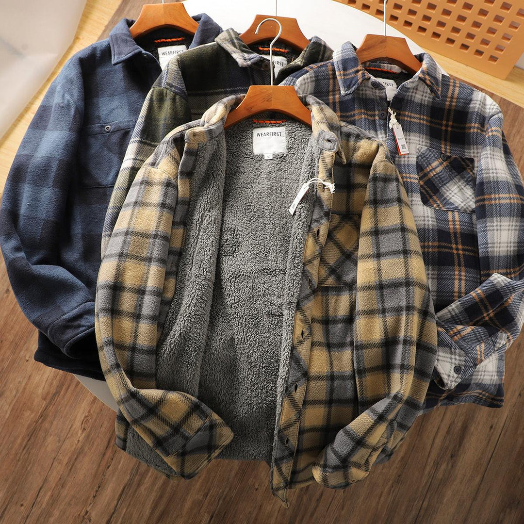 Cotton-padded coats in plaid and solid blue on wooden hangers, button-front and pockets