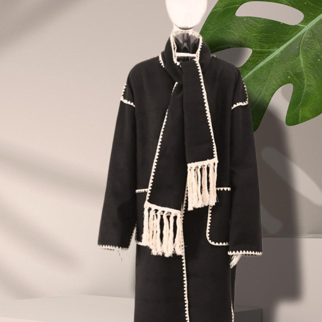 Women's black long wool coat with white trim, tassel lace panels, shawl collar