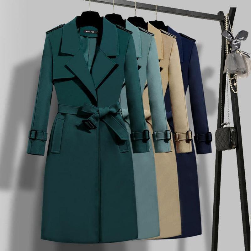 Dark green mid-length trench coat with notched lapels and waist tie belt