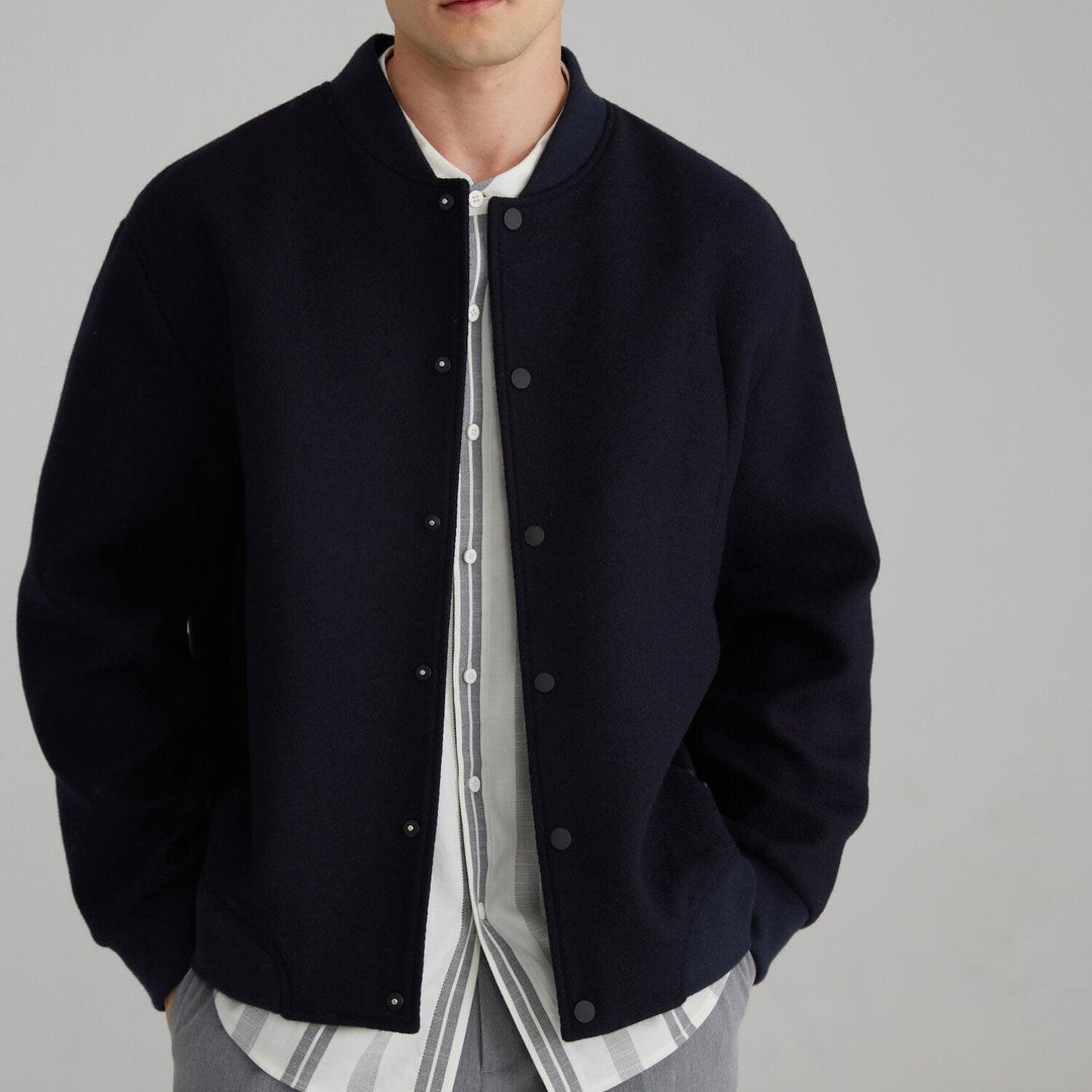 Navy wool coat with rib-knit collar, snap-front and contrast patchwork ribbon