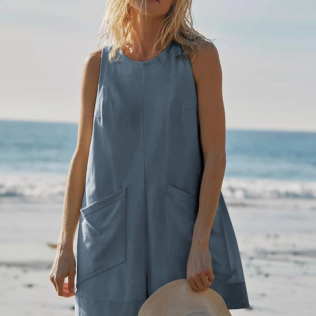 Women’s sleeveless loose jumpsuit in blue-gray with scoop neckline and front patch pockets