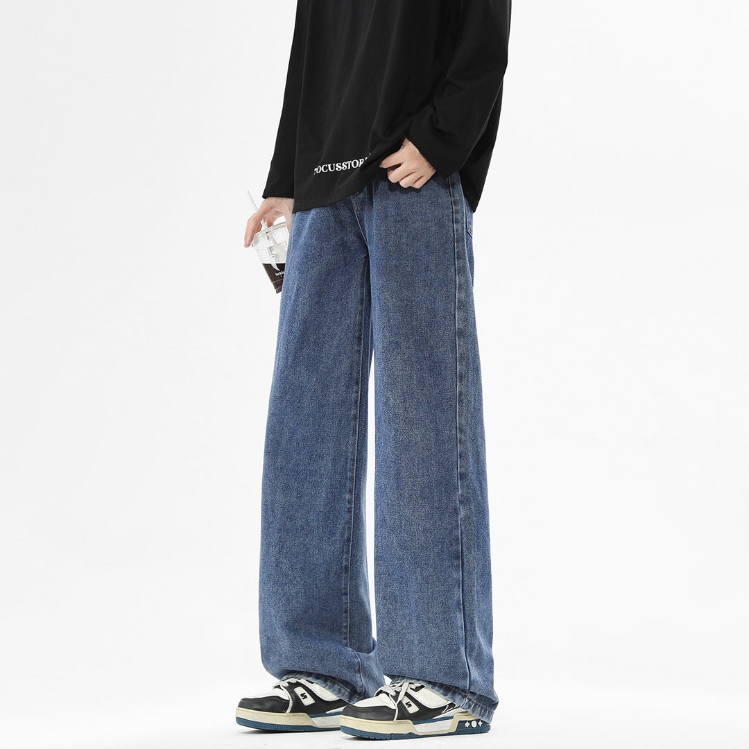 Washed dark blue wide-leg denim trousers with loose fit and side pockets