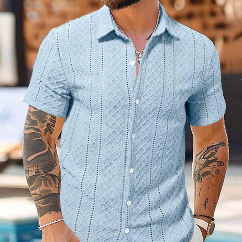 Light blue casual button-sleeve shirt with button front and textured diamond pattern.