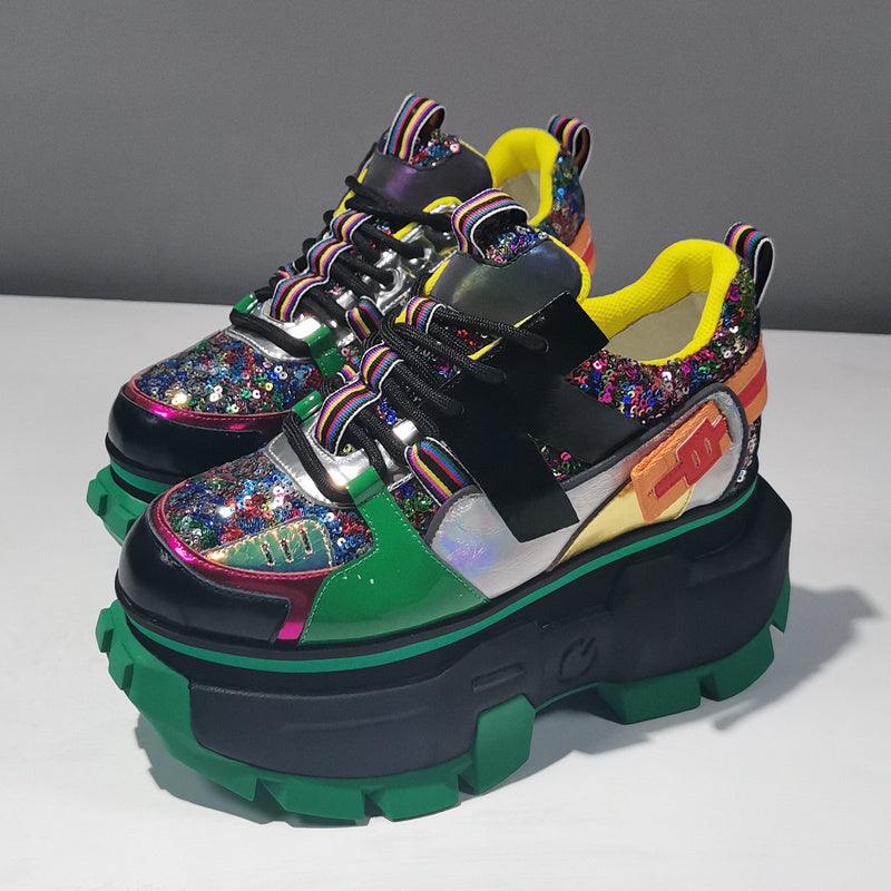 Chunky platform sneaker with green and black color-blocking, glitter sequin panels