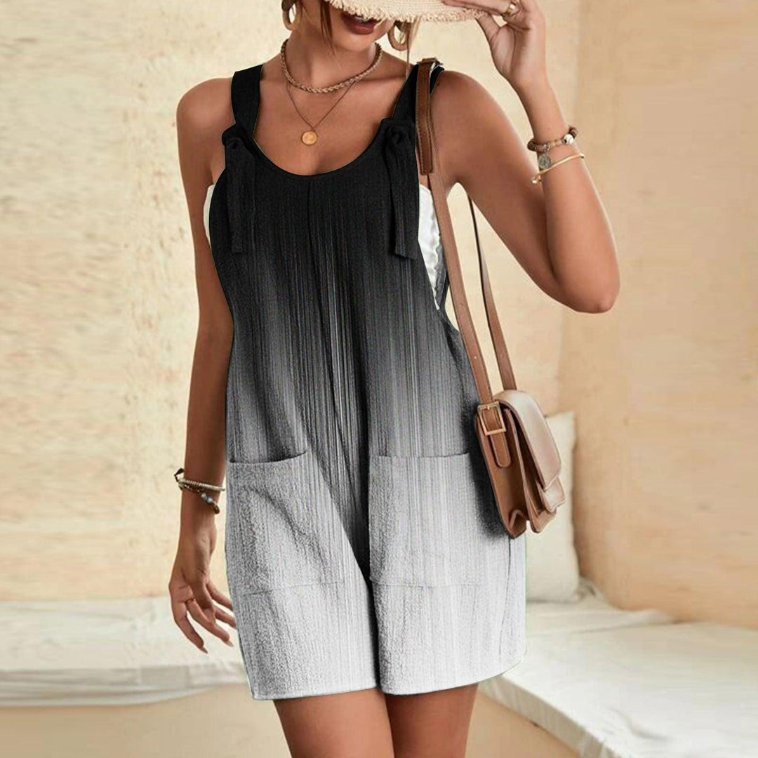 Black-and-white sleeveless suspender pants romper with scoop neck and side pockets