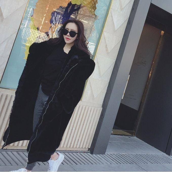 Women’s hooded fur jacket in dark black, full-zip front with thick plush texture