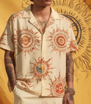Cream short-sleeve button-up shirt with red sun and eye graphic print, open collar