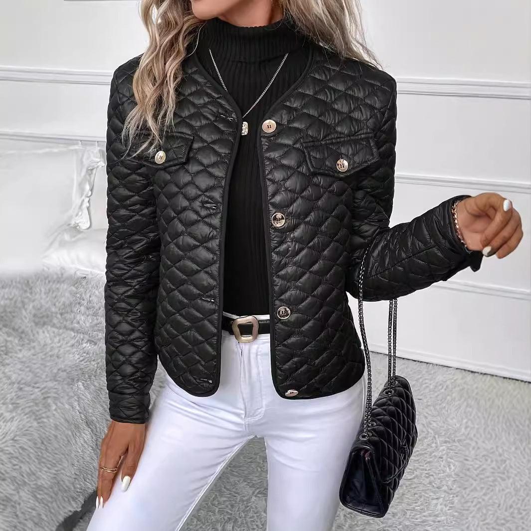 Black quilted padded coat with gold snap buttons and flap chest pockets