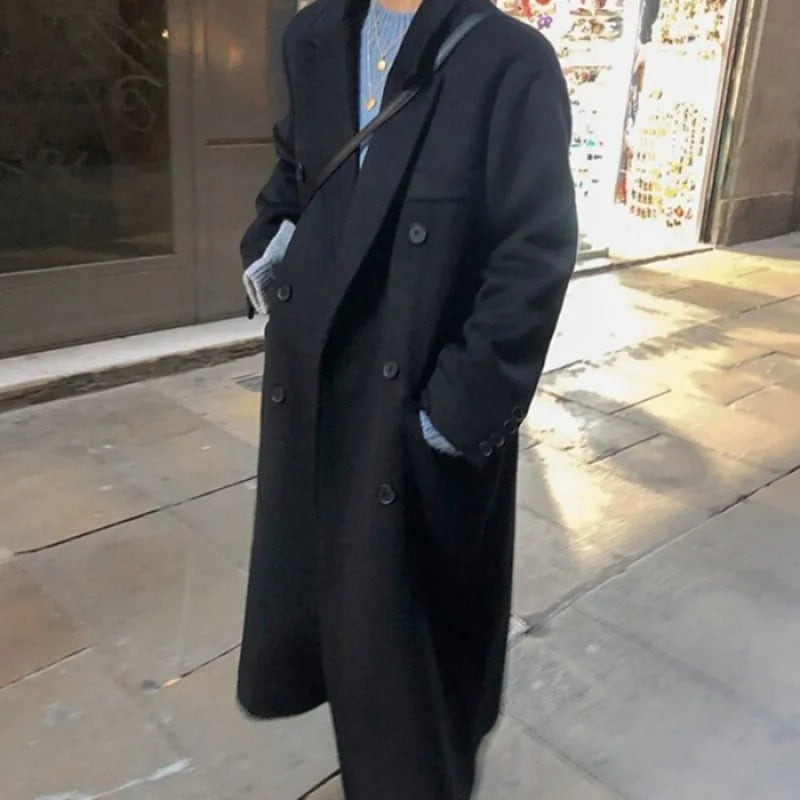 Women’s black long coat with double-breasted buttons and notched lapels