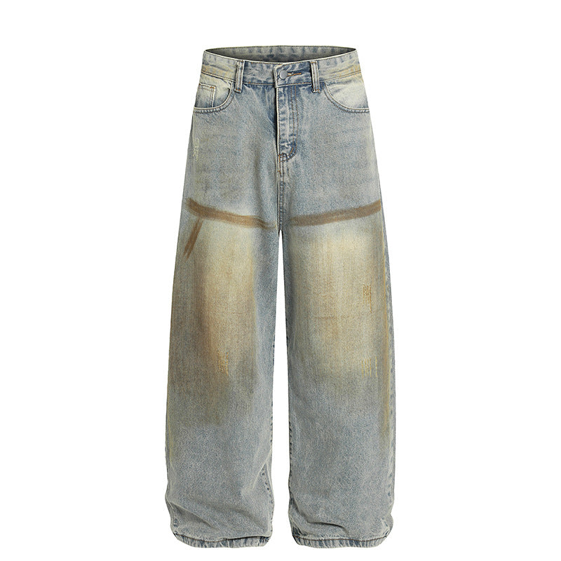 Light blue denim jeans with yellow-dyed center panels and loose wide-leg cut