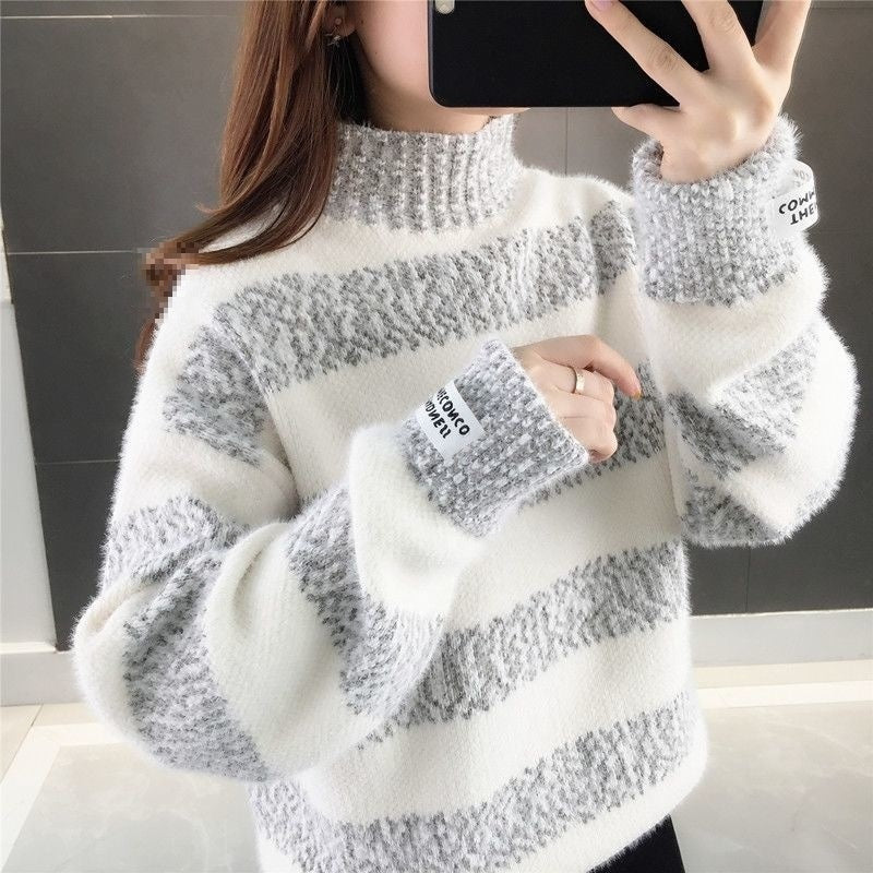 White knitted base-layer top with gray patterned stripes and ribbed cuffs