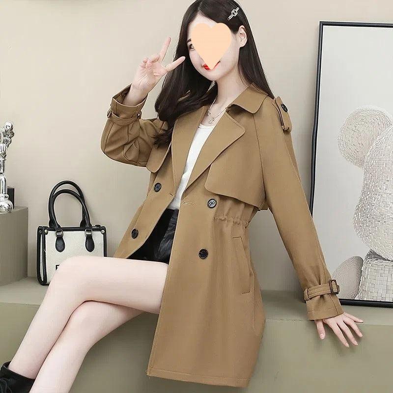 Women's mid-length trench coat in caramel brown, loose fit, double-breasted buttons, flap pockets