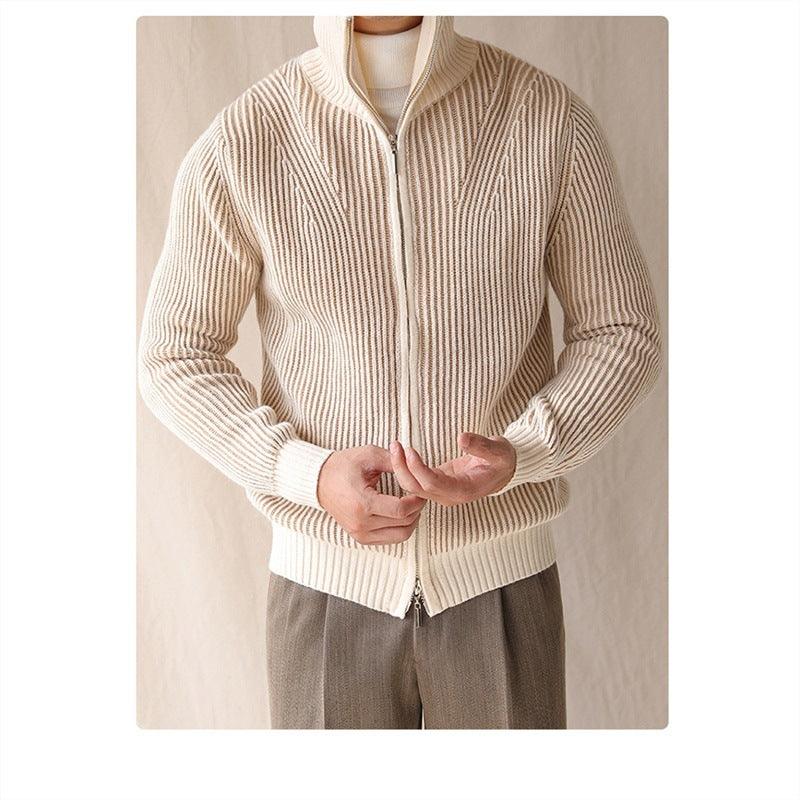 Beige thick knit sweater with vertical rib stripes and full-zip front, hands at zipper