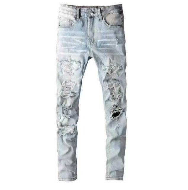 Men's slim ripped jeans in light blue wash with multiple torn patches at knees