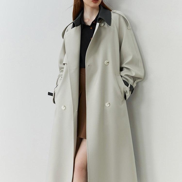 Women’s light beige windbreaker coat with dark turn-down collar and button front