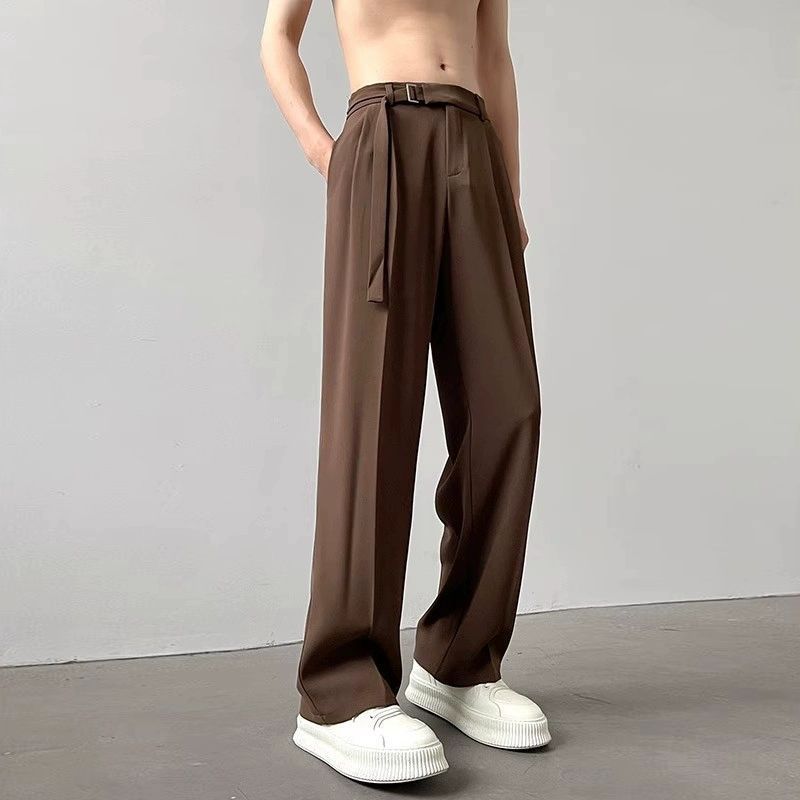 Brown high-waist wide-leg pants with belt tie, pleated front and side pockets