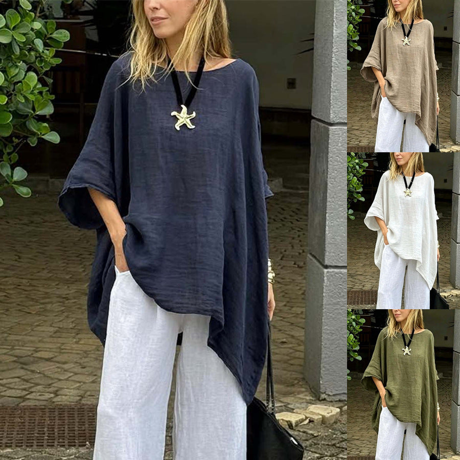 Womens solid round-neck casual top, dark navy blue, loose fit with draped asymmetric hem