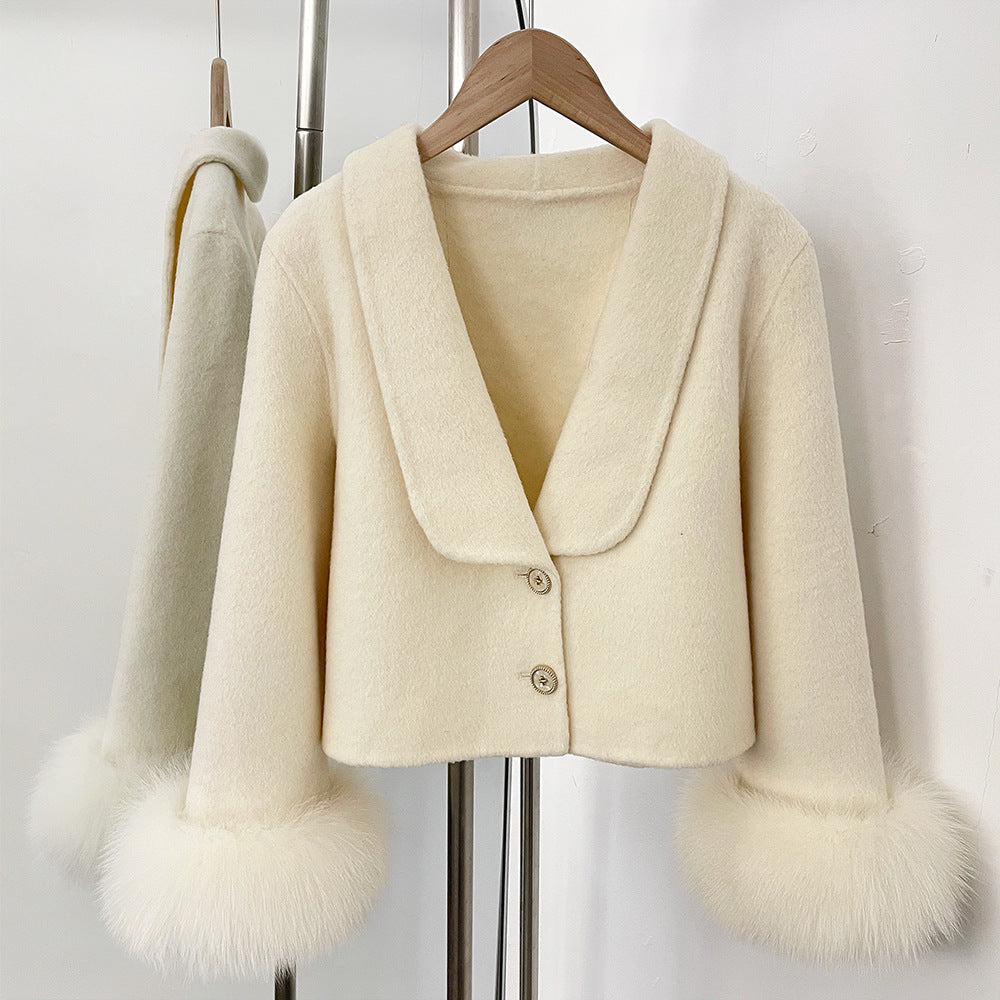 Light cream double-faced wool-cashmere coat with draped lapel, button front, and faux fur cuffs