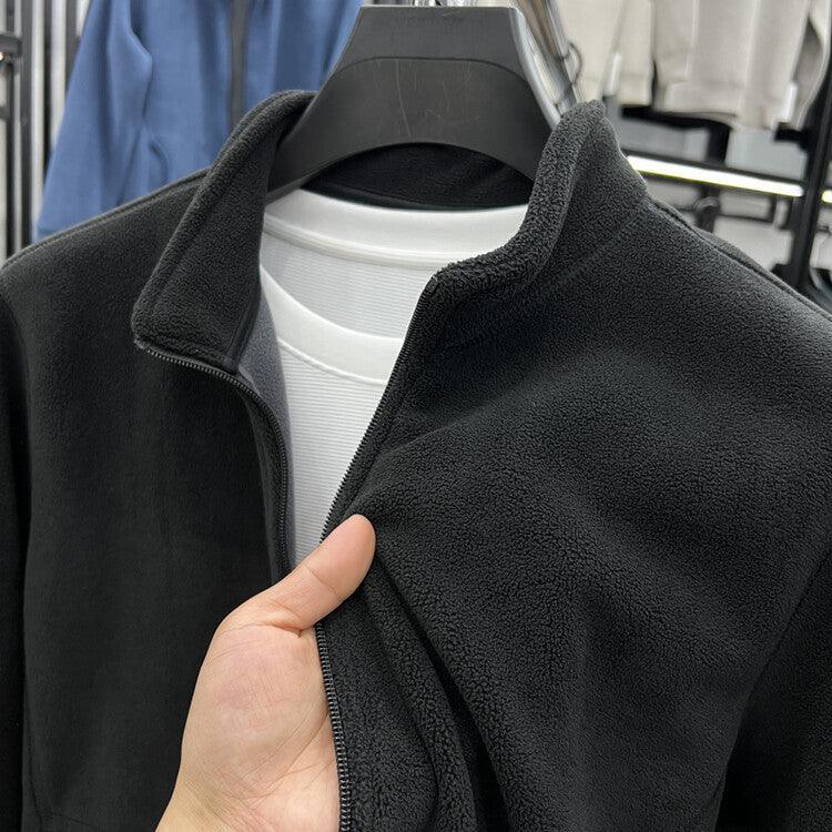 Black men’s stand-collar polar fleece jacket with zip front, collar and chest close-up