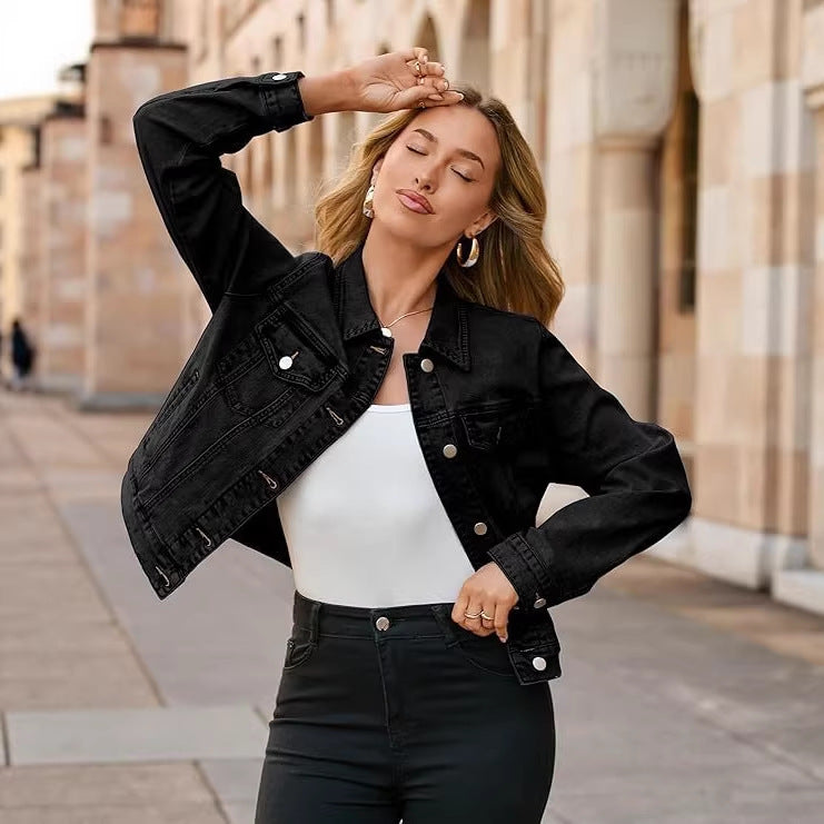 Women's black denim jacket with button-front and chest flap pockets